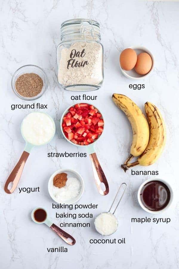 ingredients for making banana strawberry oatmeal muffins with captions.