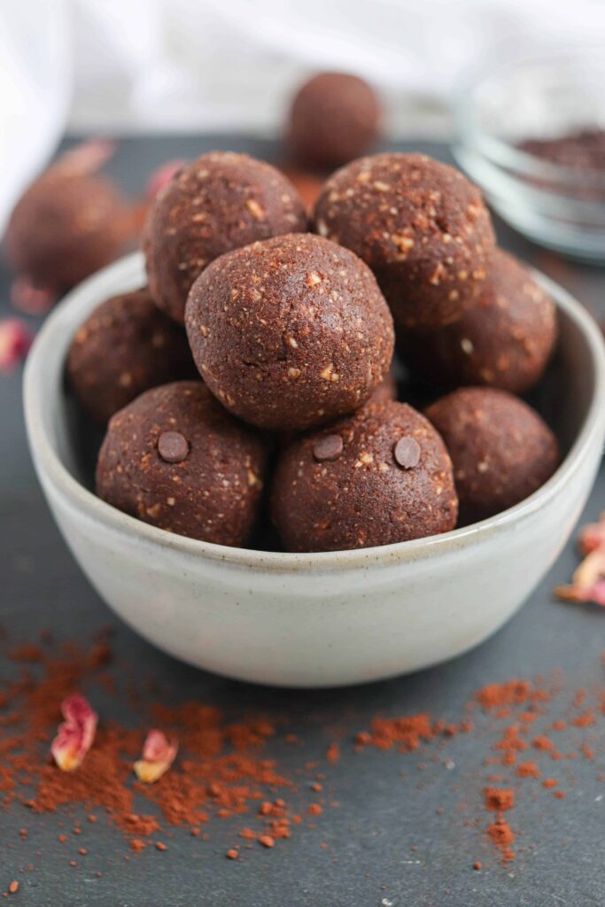 chocolate bliss balls in a small gray bowl.
