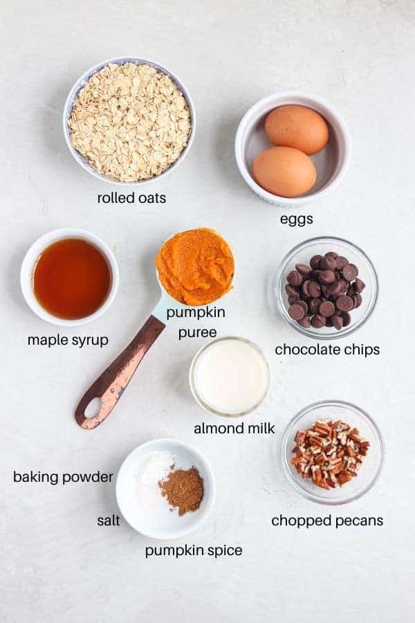 round dishes with ingredients for making blended baked oats on a gray surface with labels