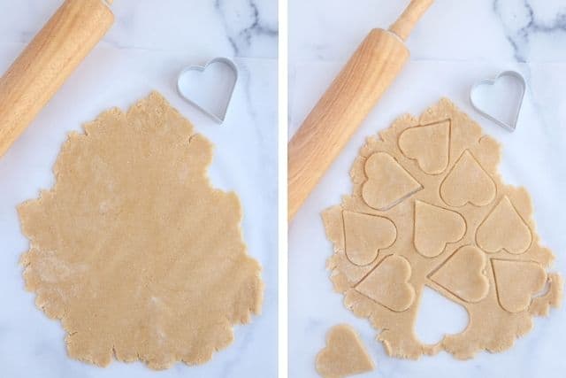 vegan cookie dough rolled out and cutting out heart cookies.