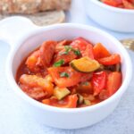 tomato and pepper stew in a white bowl