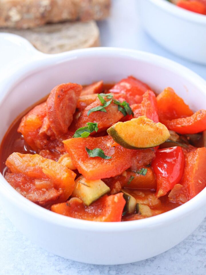 tomato and pepper stew in a white bowl