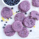 purple blueberry lemon cookies on white paper.