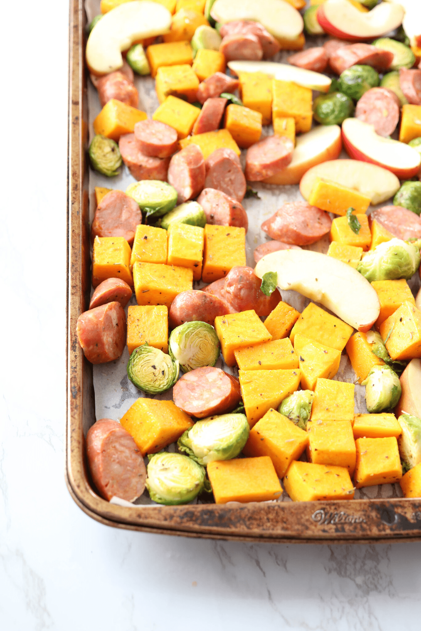 apple sausage butternut squash brussel sprouts sheet pan dinner.