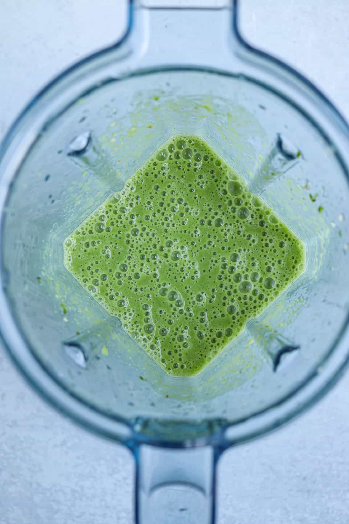 green smoothie in a Vitamix blender, overhead view.
