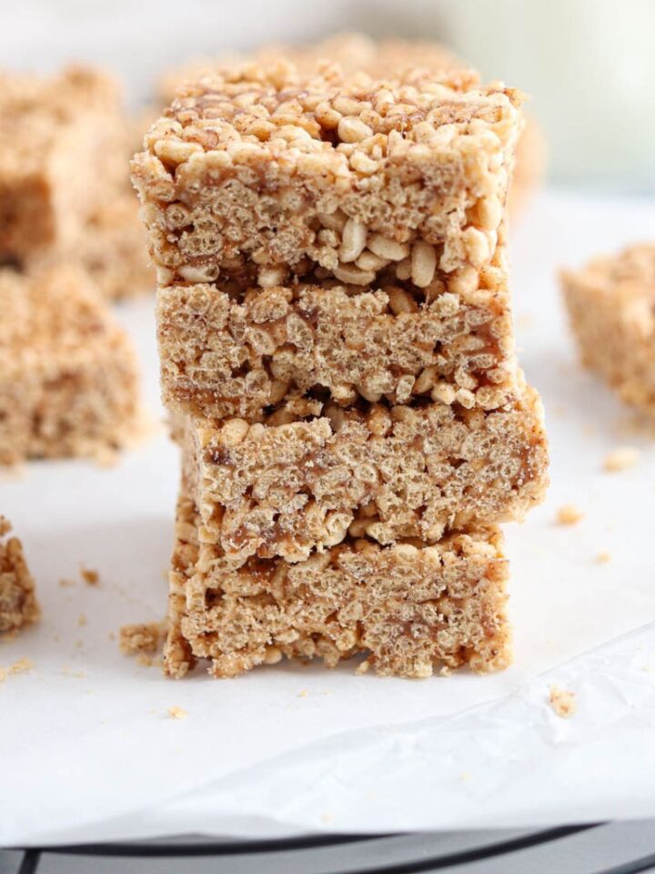 a stack of rice krispie treats made with almond butter on white paper.