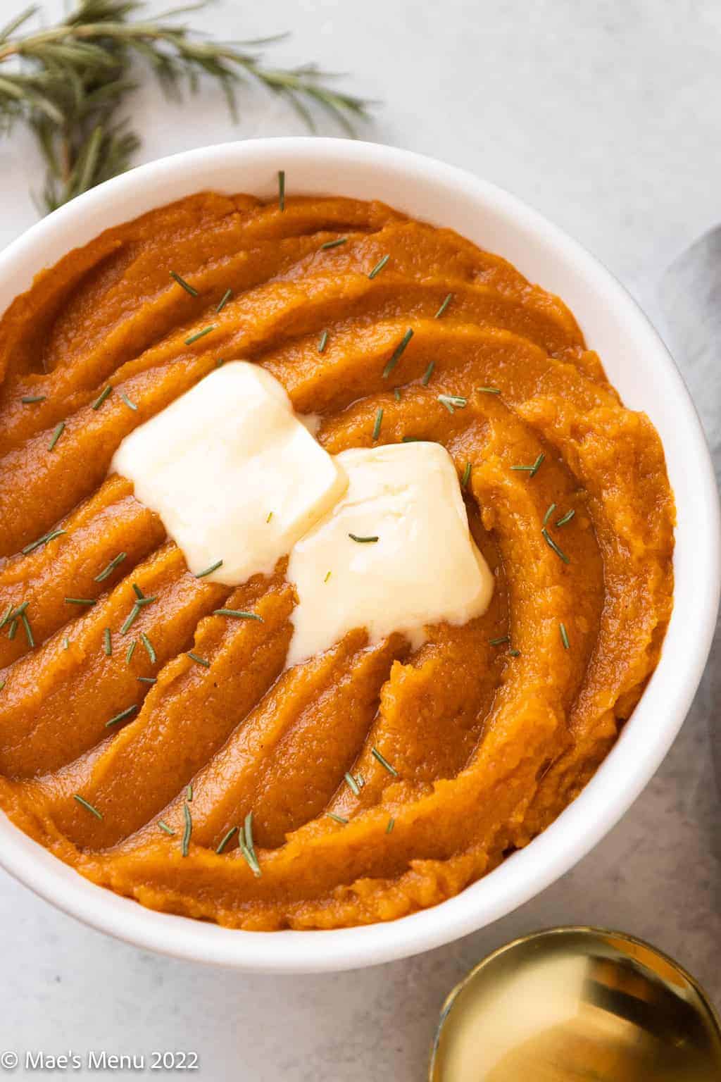 whipped sweet potatoes with butter on top. 