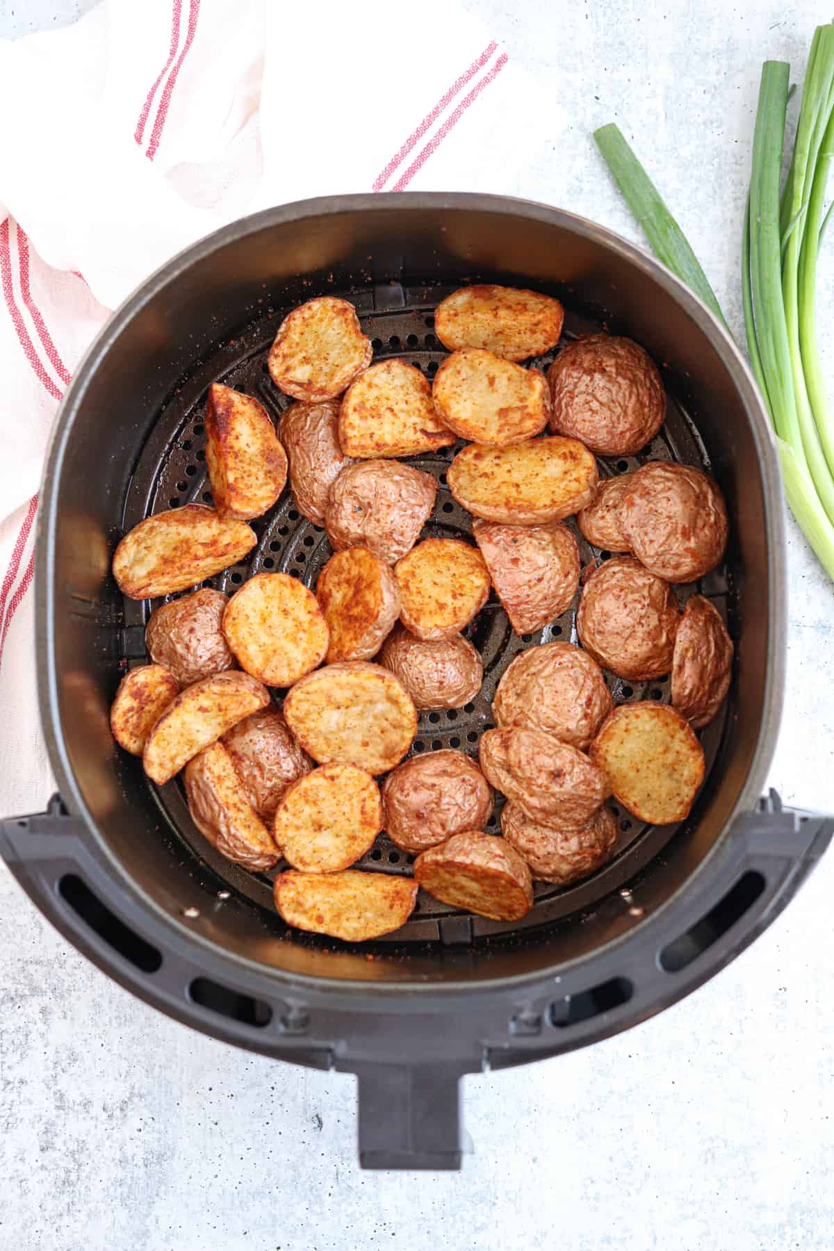 air fried red potato halves in the air fryer.